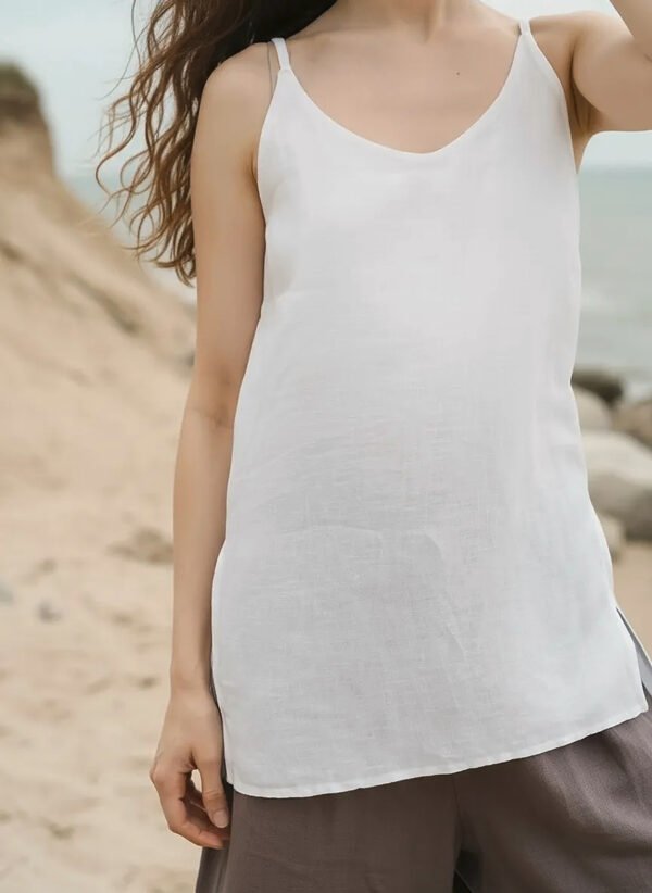 Linen-cami-top-front Front view of a light, airy linen cami top with V-neckline and thin straps, designed for a relaxed and elegant fit.