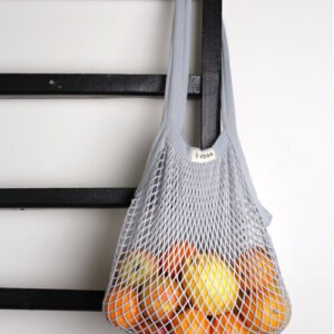 Gray mesh bag with fruits