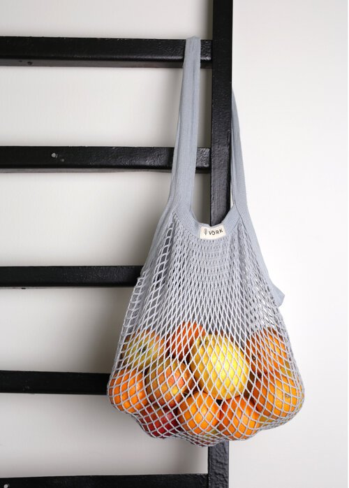 Gray mesh bag with fruits